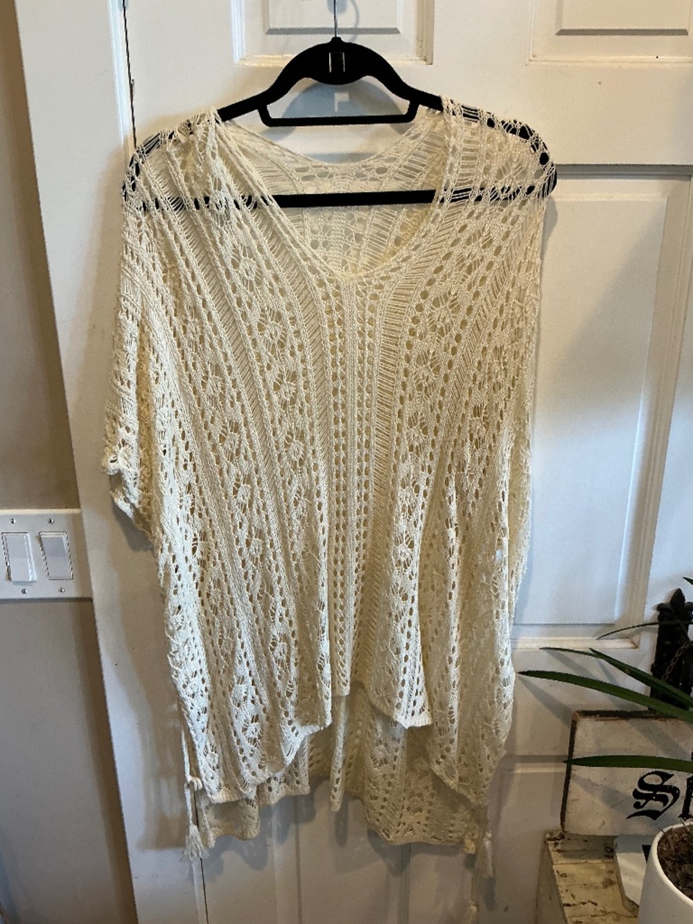 Fun pullover layering top with tassels!